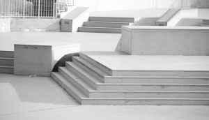 white concrete staircase with white wooden railings